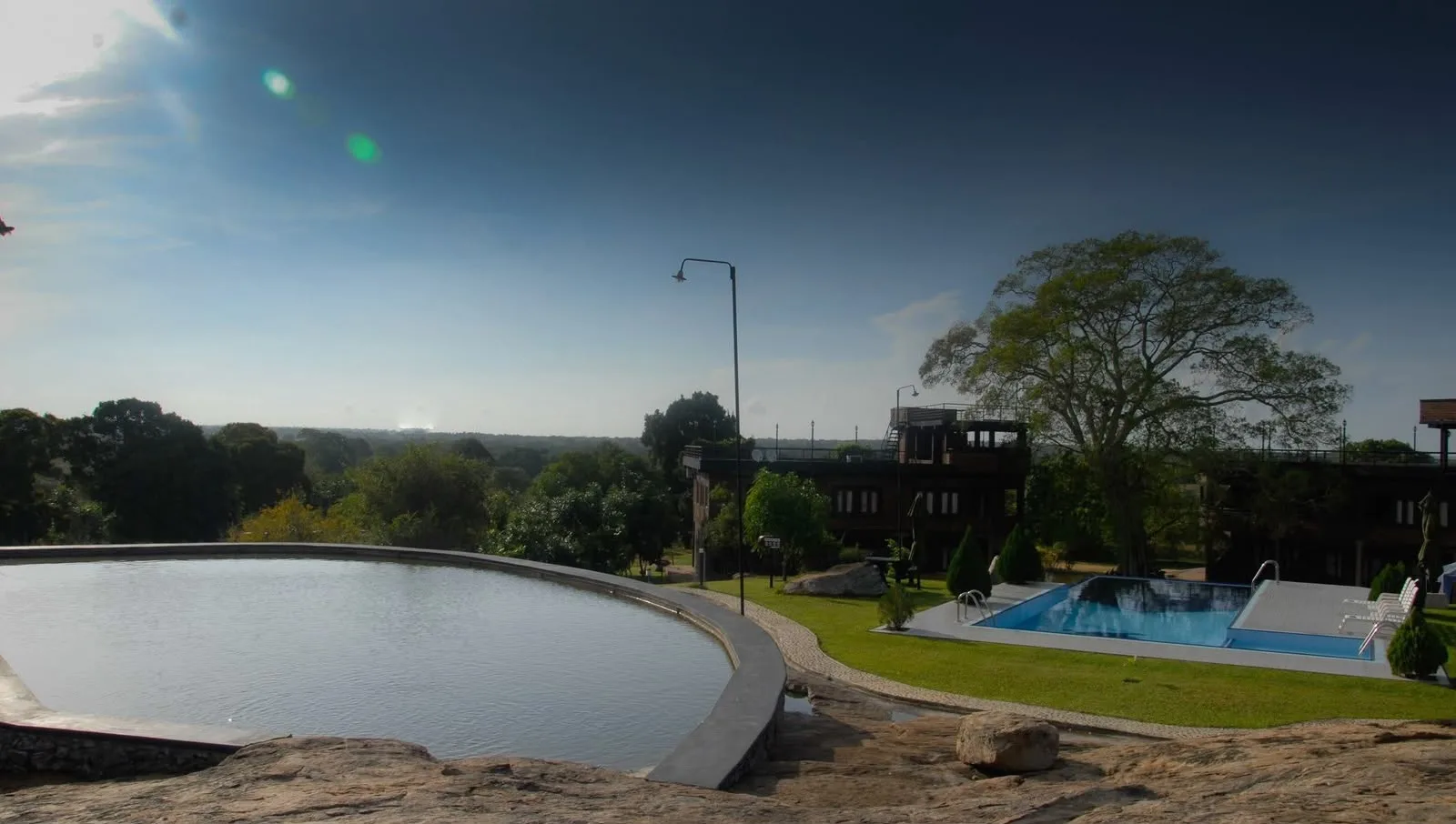 Vintara Eco resort: the natural rock pool, swimming pool and lodge buildings at Gonnoruwa